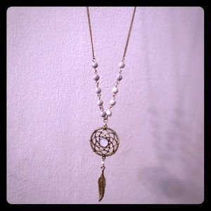 One gold and white dream catcher necklace